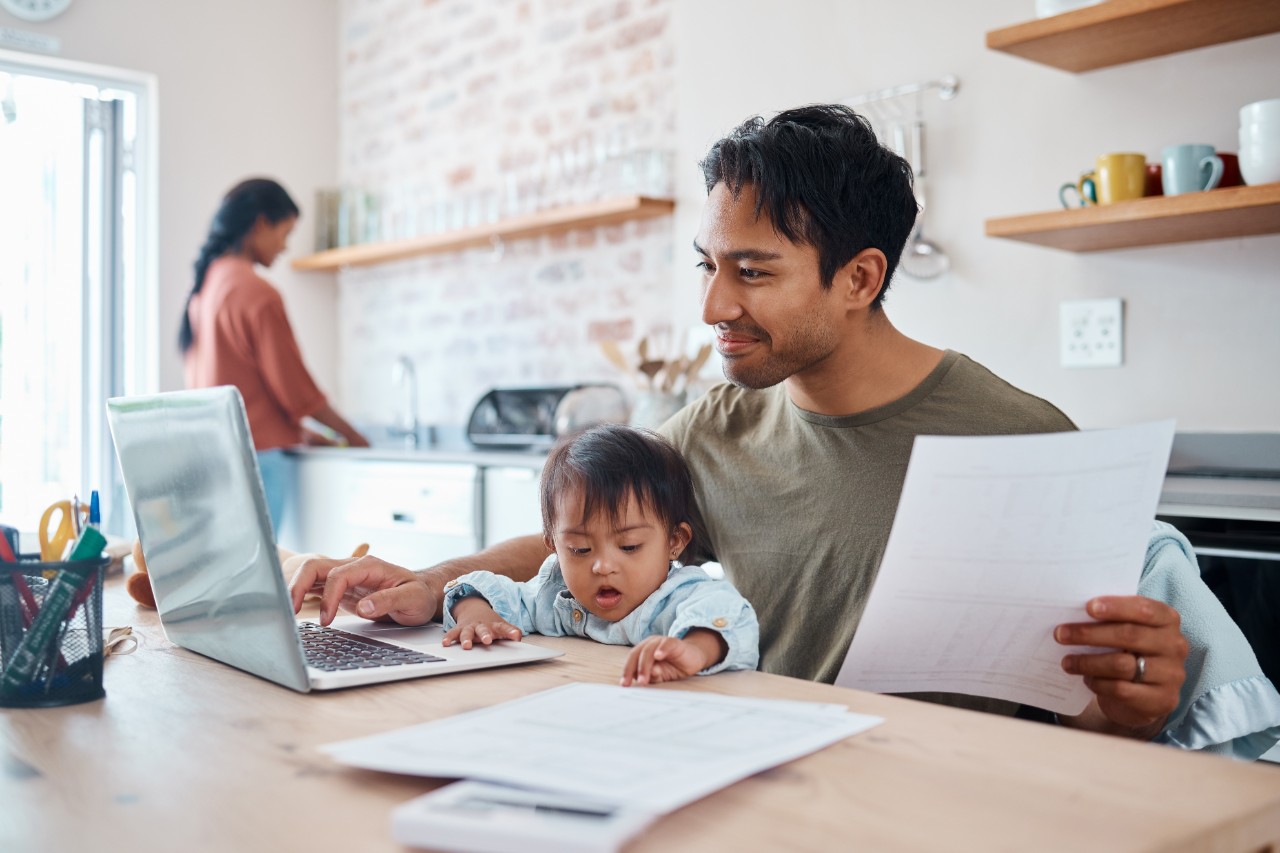 Man, baby or laptop finance in house or home kitchen and insurance paper, investment documents or fintech accounting software. Happy smile, asian father and down syndrome boy, son and child with tech Man, baby or laptop finance in house or home kitchen and insurance paper, investment documents or fintech accounting software. Happy smile, asian father and down syndrome boy, son and child with tech.